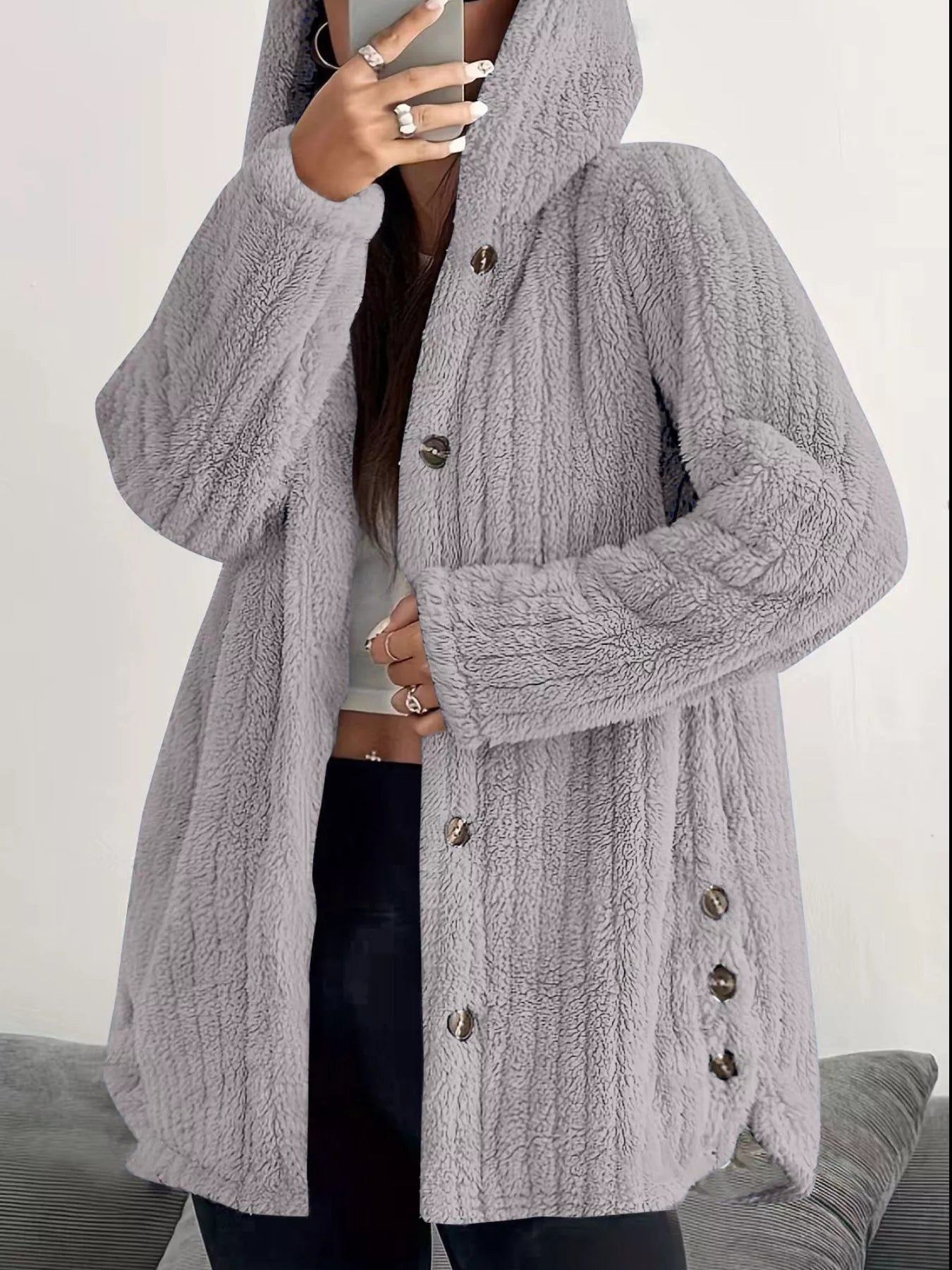 Cozy button-up fleece jacket in light grey with a hood and dark buttons.