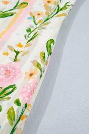 Floral print shift dress with pink and yellow flowers, green leaves, and striped accents.