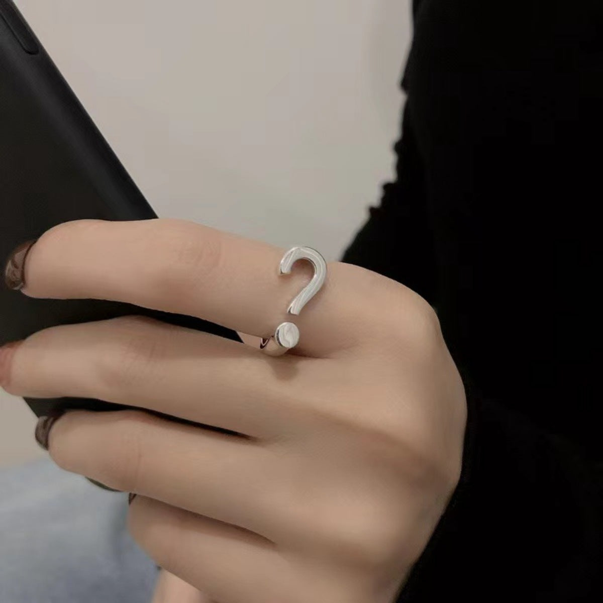 Sterling silver open ring with a question mark design.