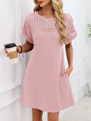Blush pink t-shirt dress with short sleeves and a sheer lace yoke detail.