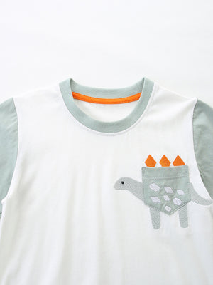 Toddler boys' white cotton tee with dinosaur pocket and grey sleeves.
