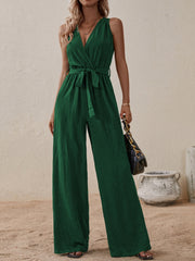 Dark green textured wrap-front wide-leg jumpsuit with tie waist and V-neck