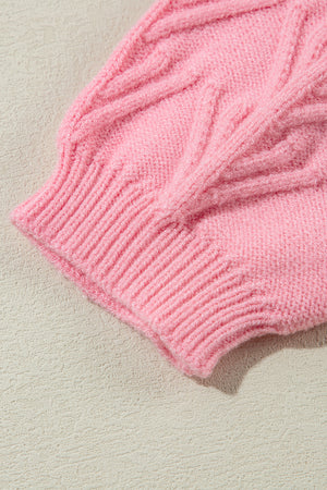 Blush pink knit sweater with cable knit detail and ribbed cuff.
