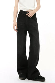 Black denim straight leg jeans with whiskered details.