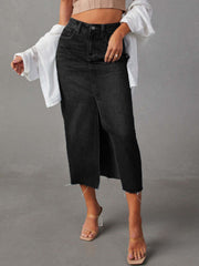 Dark denim midi skirt with raw hem and front slit, buttoned waist.