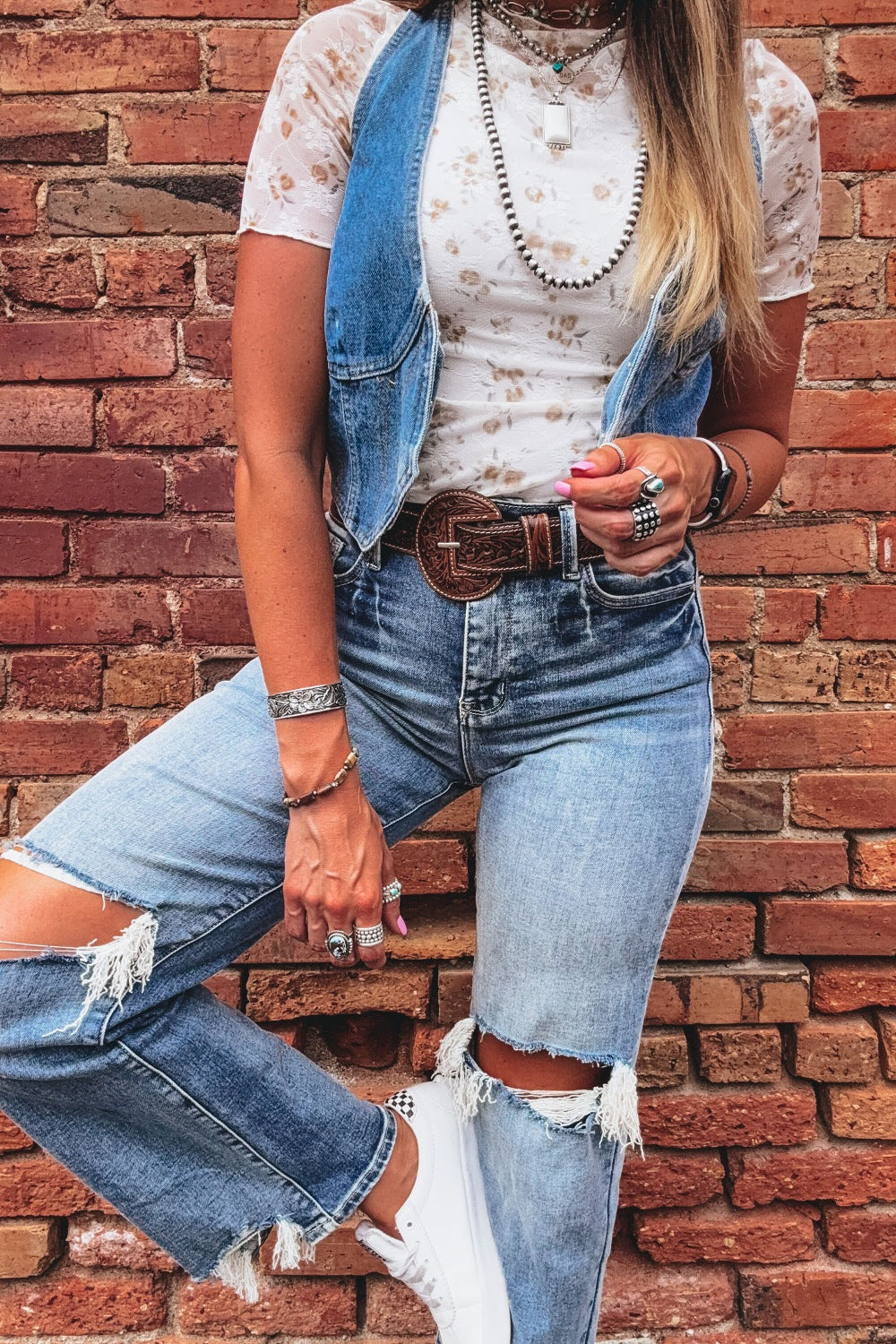 Lace mock neck t-shirt with floral pattern and short sleeves.