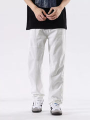 Men's white cotton jeans with pocketed design and relaxed fit