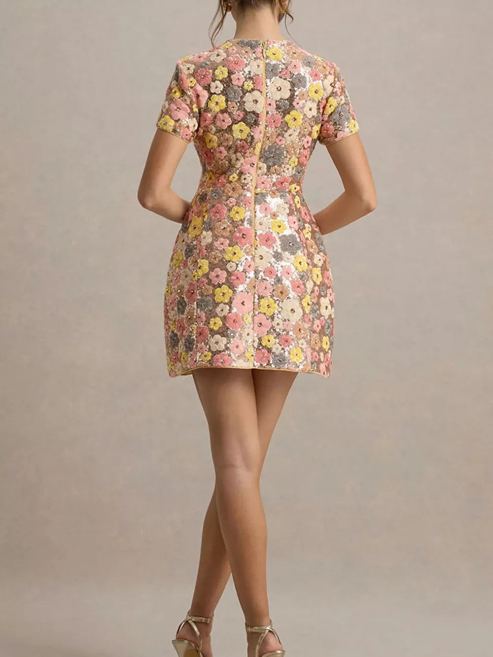 Floral sequin mini dress with short sleeves and a zip back.