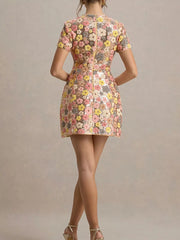 Floral sequin mini dress with short sleeves and a zip back.