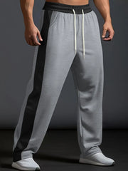 Gray track pants with black side panel detail and drawstring waist.