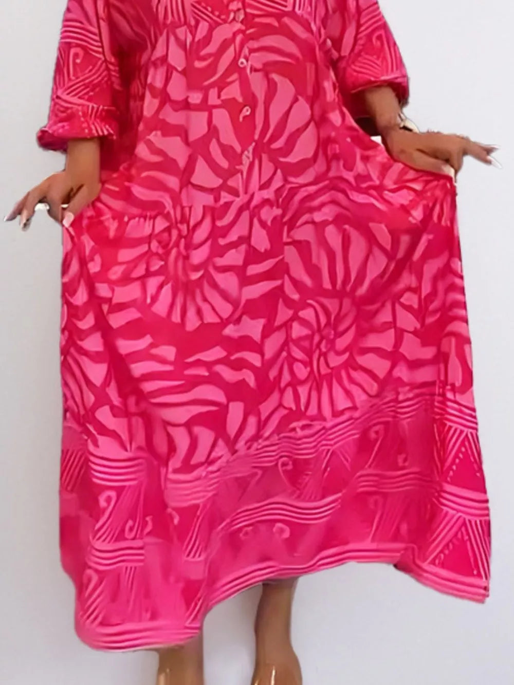 Hot Pink abstract print midi dress with button front and ruffled sleeves.