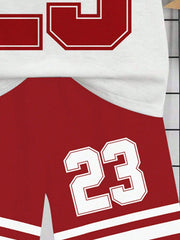 Children's red athletic shorts with white number 23 graphic and white stripe detail.