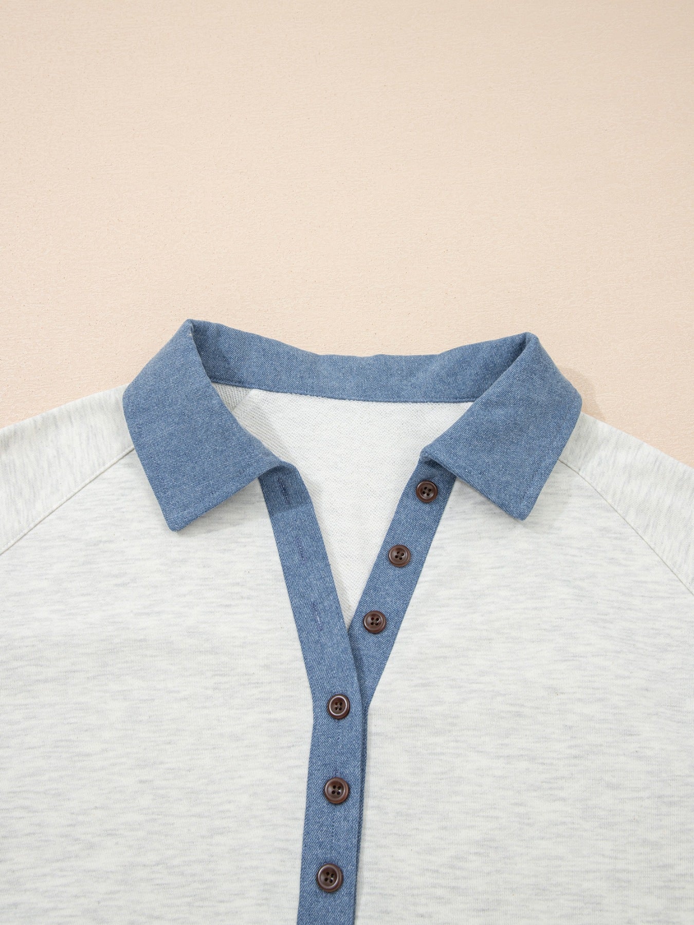 Heathered casual top with blue collar and button detail
