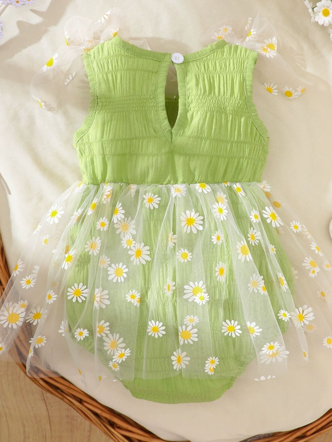 Green baby bodysuit dress with smocking and daisy print tulle overlay