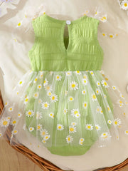 Green baby bodysuit dress with smocking and daisy print tulle overlay