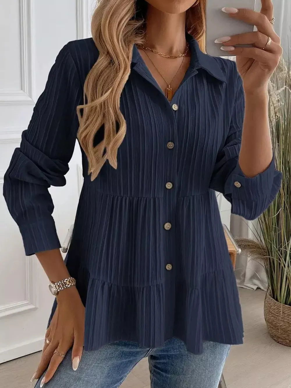 Dark Blue textured tiered button-down shirt with crinkled fabric and button details.