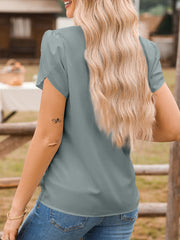 Notched neckline petal sleeve blouse in dusty blue with a relaxed fit.