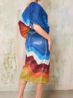 Denim asymmetrical top and slit skirt set with a rainbow chevron print and distressed details.