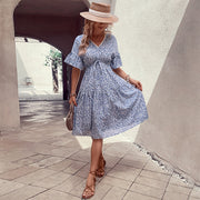 Light blue ditsy floral tiered midi dress with v-neck and flutter sleeves