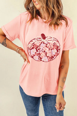 Blush pink t-shirt with a floral pumpkin graphic and a bow detail.