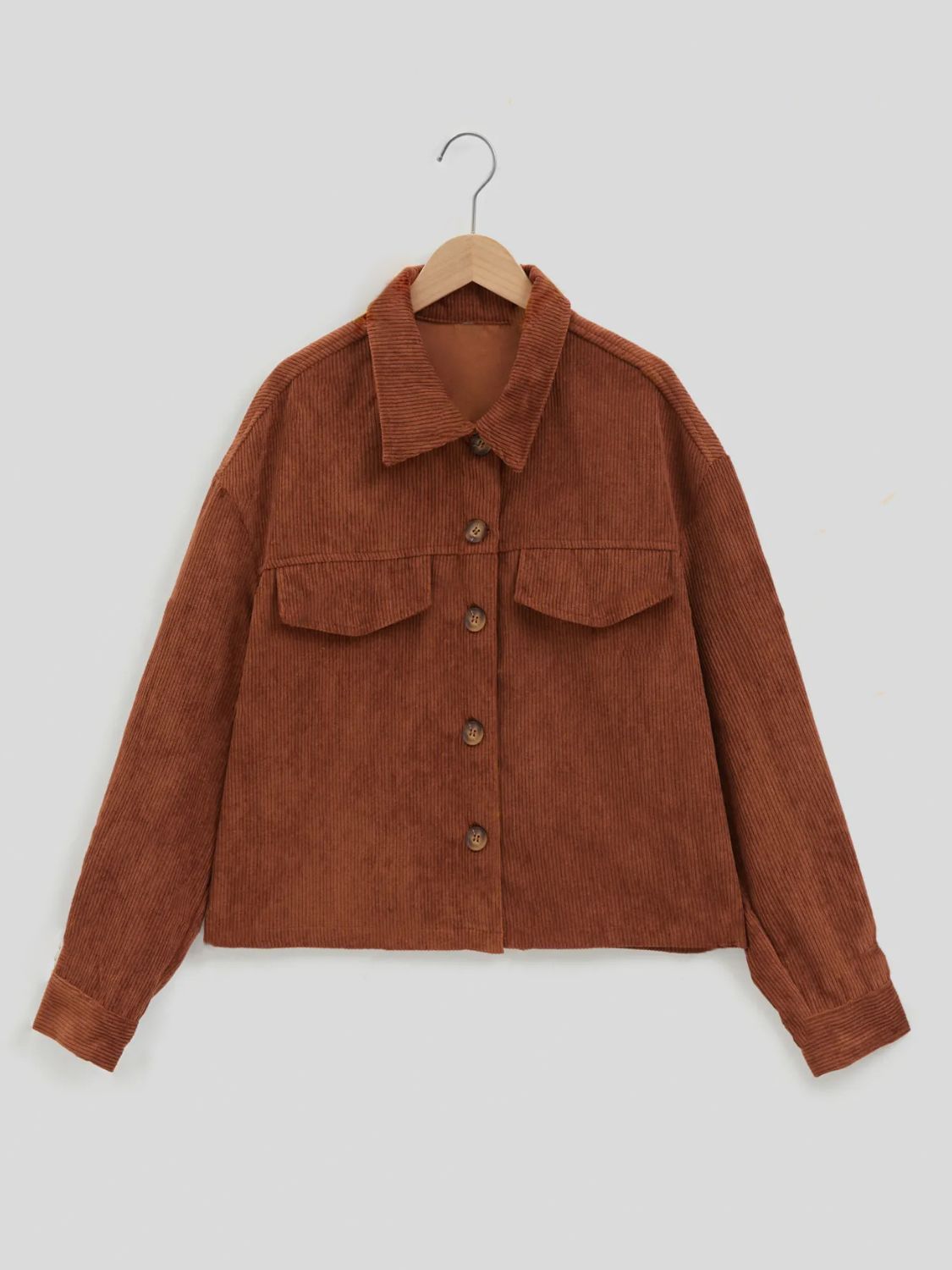 Brown corduroy utility jacket with buttoned patch pockets and collar.