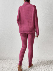 Textured turtleneck lounge set in hot pink with ribbed details.