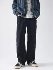 Black cotton wide-leg trousers with panel detailing and a relaxed fit.