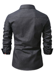 Dark gray denim shirt with button details on cuffs and pocket flaps.