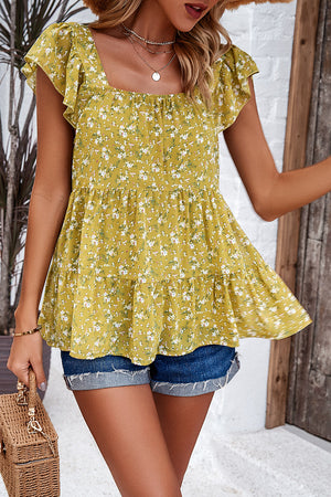 Chartreuse floral peplum blouse with flutter sleeves and tiered hem.
