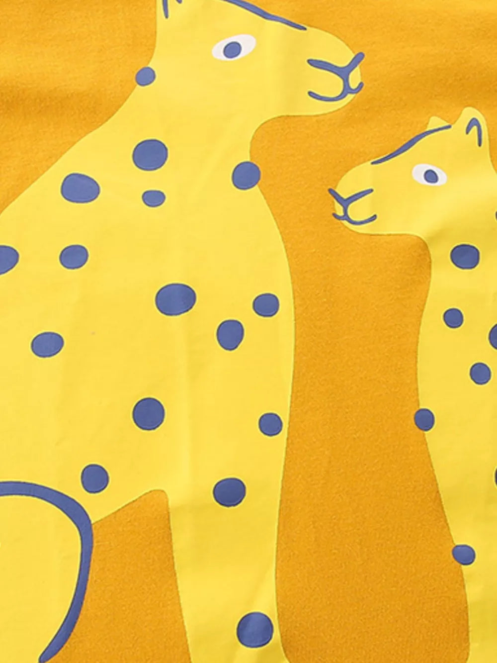 Yellow cotton t-shirt with playful blue spotted leopard graphic.