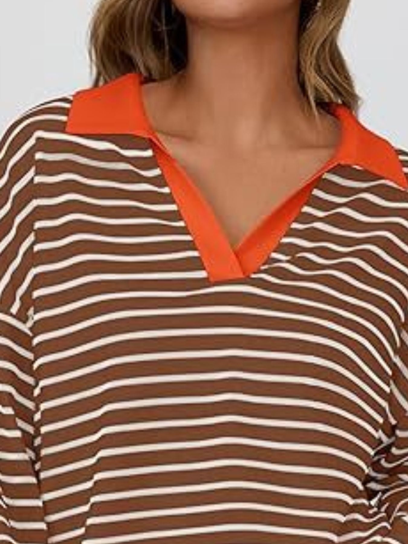 Oversized striped long-sleeve sweatshirt in dark brown with white stripes and an orange collar.