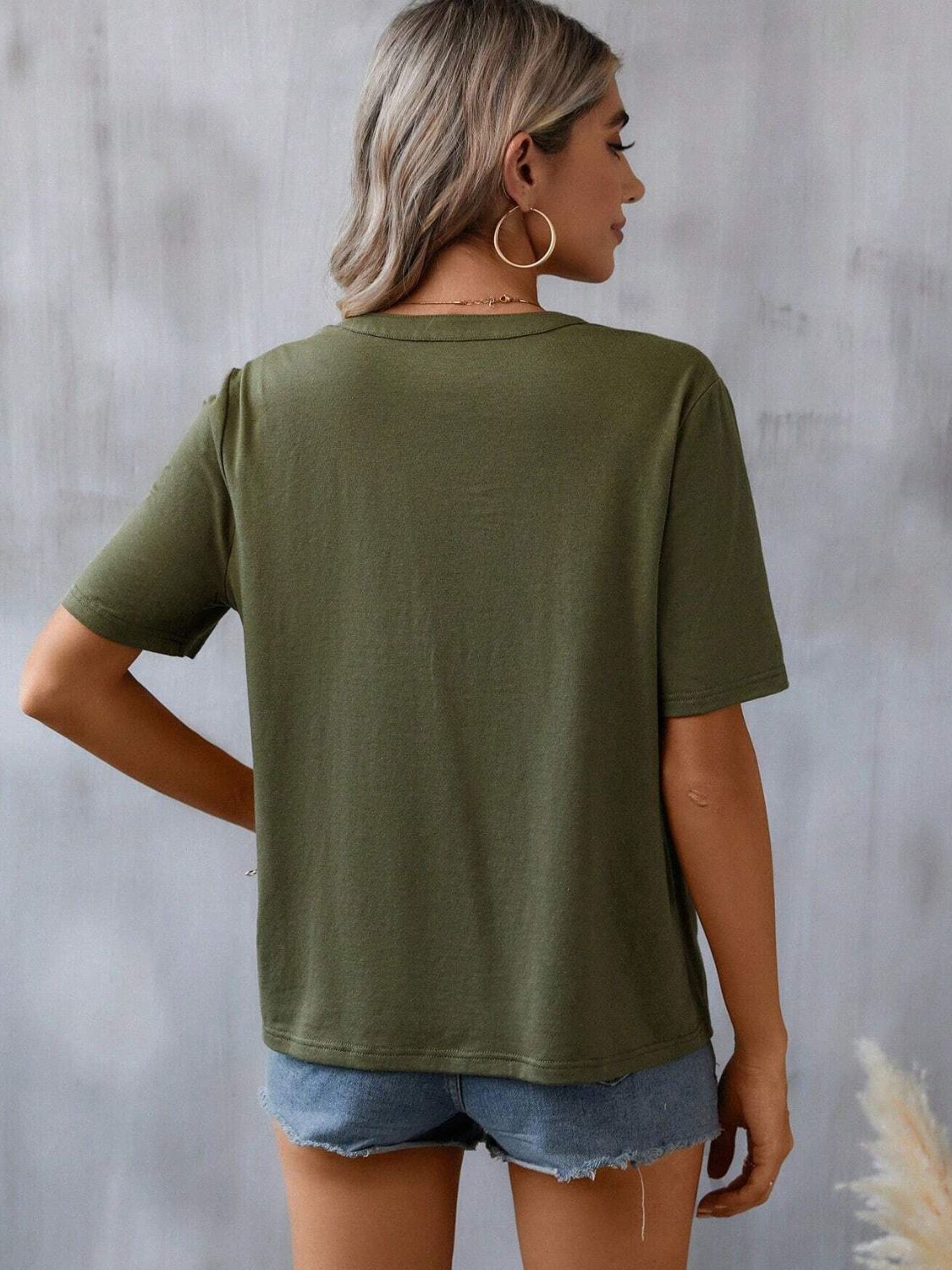 Army green v-neck tee with short sleeves and crochet trim detail.