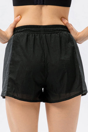 Black running shorts with elastic waistband and side panel detail.