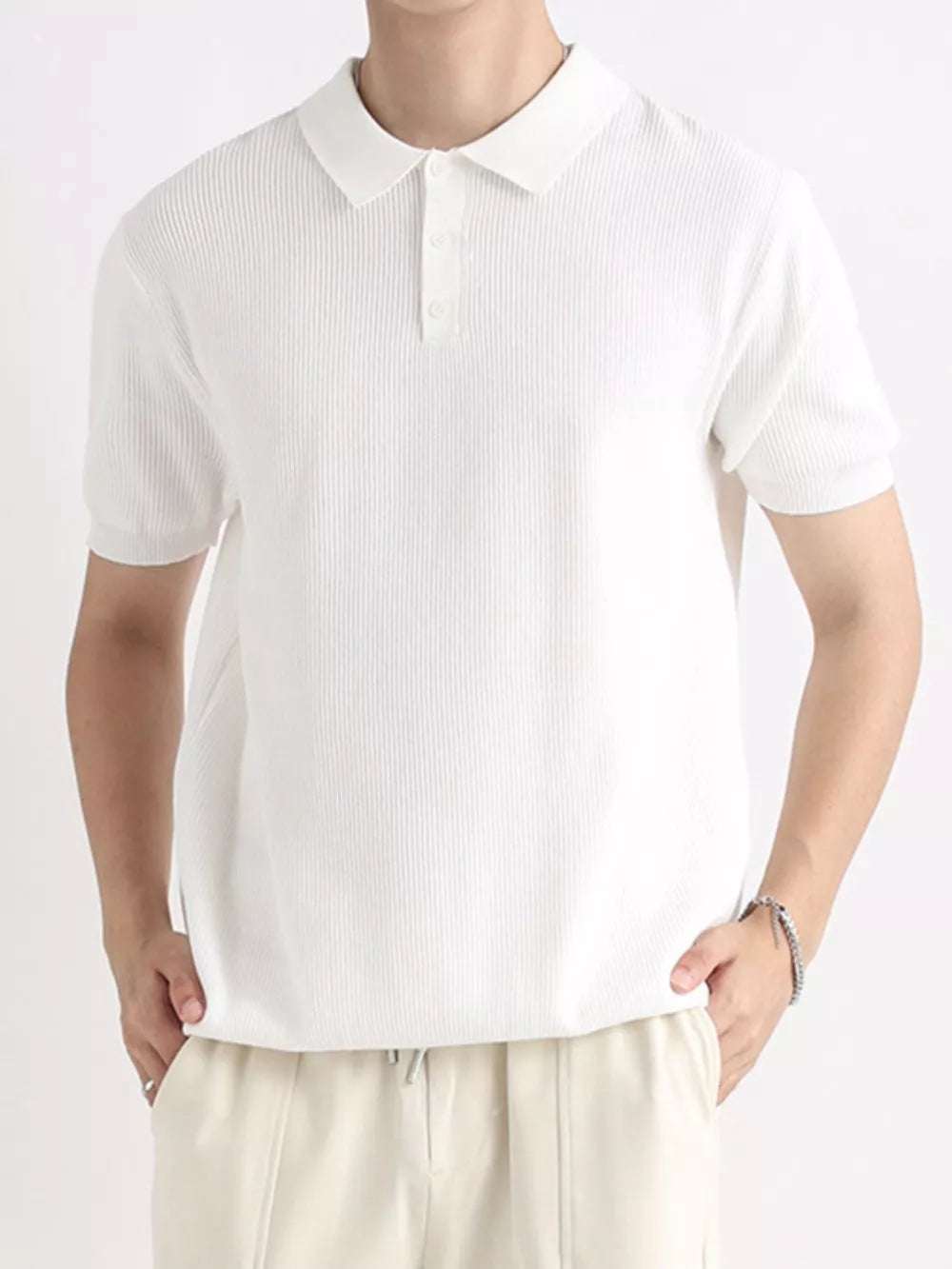 Men's white ribbed short sleeve polo shirt with classic collar and button placket.