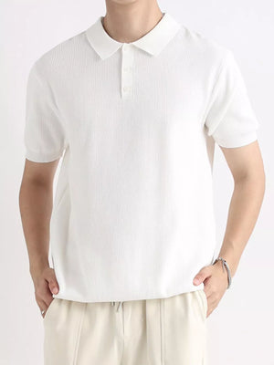Men's white ribbed short sleeve polo shirt with classic collar and button placket.