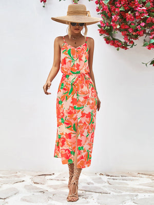 Floral print midi dress in red-violet and orange with spaghetti straps and a button-down front.