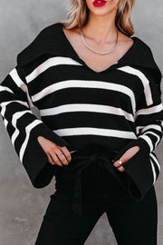 Black and white striped knit sweater with wide collar and bell sleeves, tied at waist
