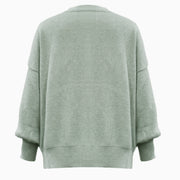 Sage ribbed knit sweater with slouchy sleeves and a relaxed fit.