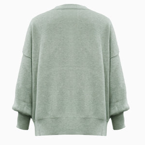 Sage ribbed knit sweater with slouchy sleeves and a relaxed fit.