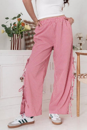 Gingham palazzo trousers in scarlet with side tie details and a wide leg.