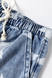 Cosmic Wash Star Print Palazzo Jeans in medium blue denim with drawstring waist and elastic waistband.