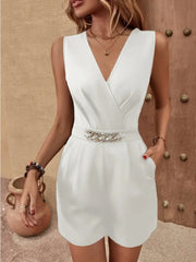 White wrap-front playsuit with chain belt detail and V-neckline