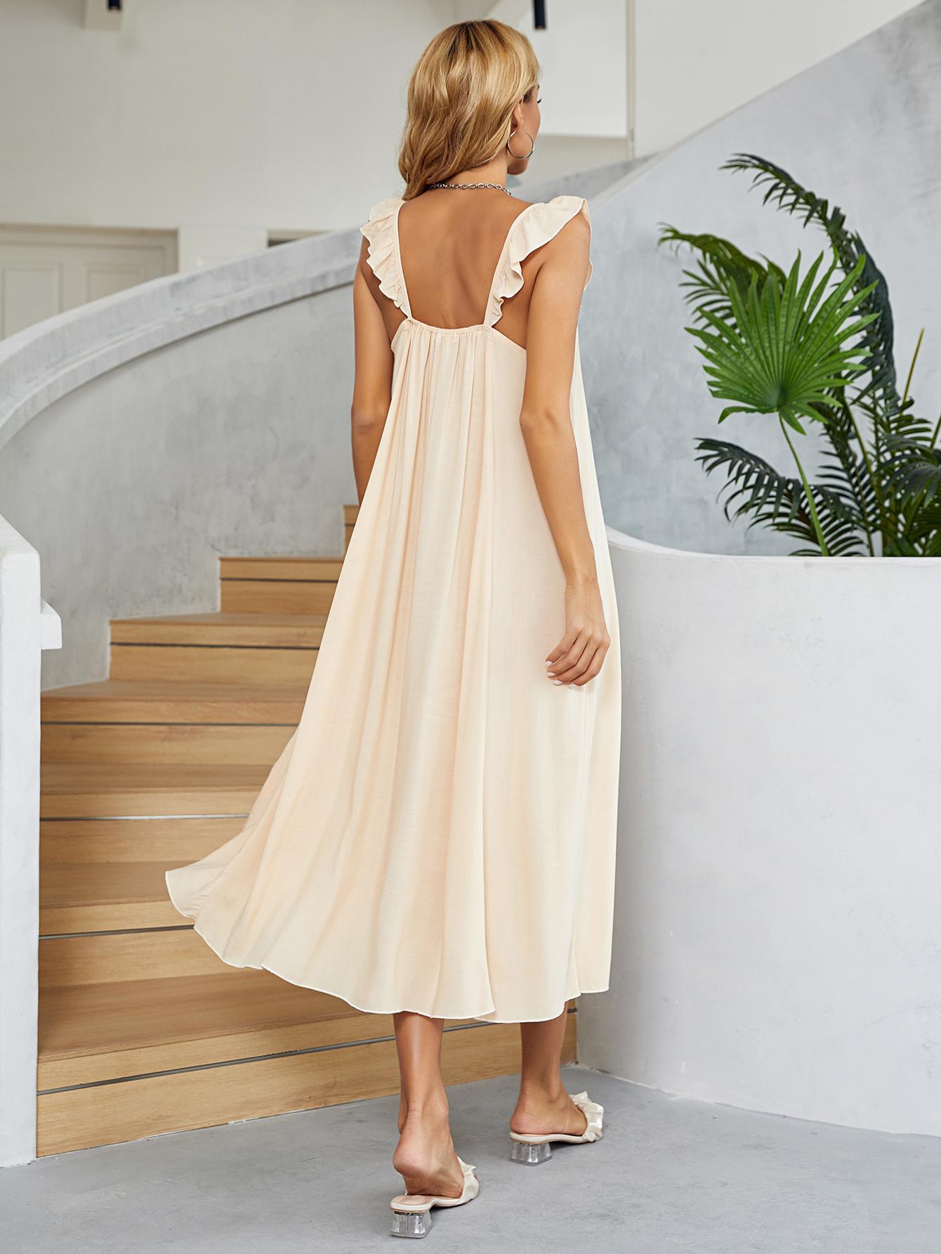 Cream midi slip dress in 100% rayon with ruffled straps and A-line cut.