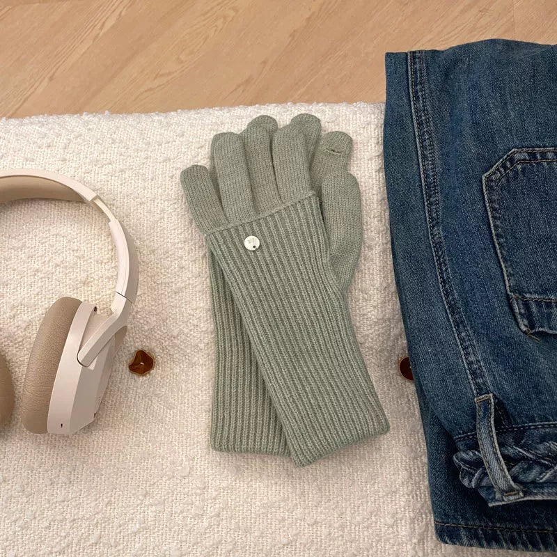 Convertible ribbed knit touchscreen gloves in green with a button detail.
