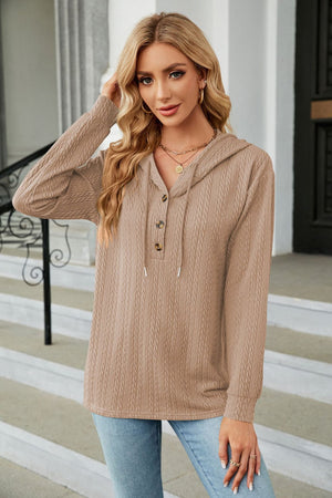 Tan textured henley hooded knit top with button detail and drawstring.