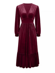 Elegant cerise velvet maxi dress with voluminous sleeves and ruffled hem