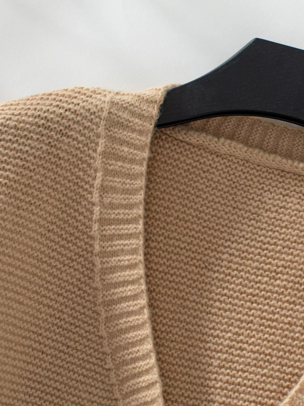Camel chunky knit open-front cardigan with ribbed trim detail.