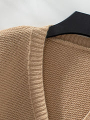 Camel chunky knit open-front cardigan with ribbed trim detail.