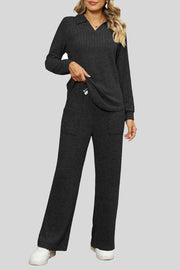 Black ribbed knit lounge set with collar and wide leg pants.