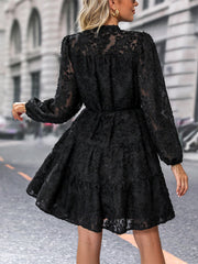 Black textured puff sleeve tiered mini dress with button detail